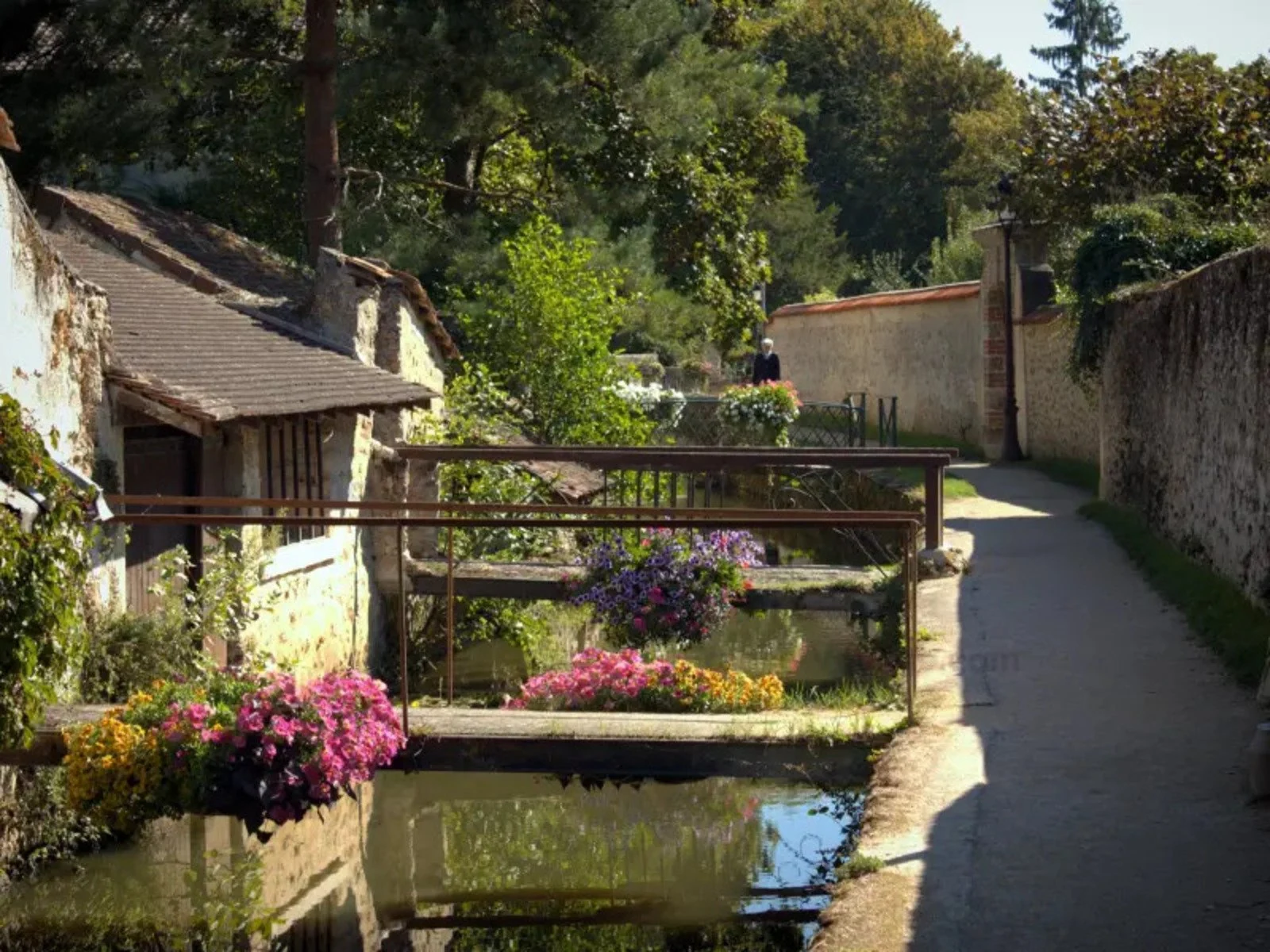 A canal and stone bridge in the Chevreuse Valley